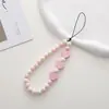 Nueva cadena para teléfono con cuentas en forma de corazón con accesorios de corazón de madera, funda de teléfono anticaída y colgante antipérdida, correa para la muñeca