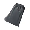 Pantalones casuales para hombre con cintura totalmente elástica, corte recto y tiro medio-alto, en colores lisos, para la temporada otoño/invierno 2026