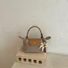Bolso Mini Exquisito de Bolas de Masa Transfronterizo Nuevo Estilo 2026 Bolso de Hombro de Paja Bolso Cruzado para Vacaciones en la Playa