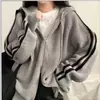 Suéter coreano de otoño e invierno, minimalista y elegante, con capucha y cordón, una prenda exterior de nicho, de corte holgado y manga larga en color gris, adecuada para figuras petite.