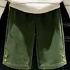 Ropa infantil coreana 2026 colección de otoño nueva: Suéter de punto a rayas color hueso y pantalones acampanados de pana verde para niños, modernos