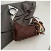 Bolso bandolera retro de nicho coreano tipo bolsa de albóndiga para mujer Otoño 2025 Nuevo Bolso de hombro cruzado moderno y simple de alta gama