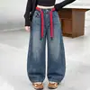 Jeans para Niñas Estilo Primavera y Otoño 2026 Nuevo Estilo Coreano para Niñas Medianas y Mayores Jeans con Bordado de Corazón Cinturón de Color Contrastante