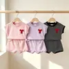 Nueva ropa para niñas de comercio exterior transfronterizo: conjunto de camiseta de rayas con top de lazo y shorts, conjunto sencillo de dos piezas de manga corta para niños