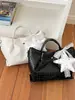 Bolso de cubo tejido de nicho transfronterizo 2026 nuevo bolso de cesta de moda para mujer bolso de mano simple para hombro cruzado
