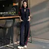 Conjunto deportivo casual para mujer, nueva colección de otoño, chaqueta a rayas de corte holgado con cuello alto, pantalones versátiles de pierna ancha, efecto adelgazante, conjunto de dos piezas