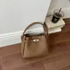 Bolsa balde retrô de nicho estilo coreano transfronteiriça para mulheres, nova bolsa de ombro casual versátil 2026, bolsa de mão, bolsa transversal