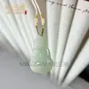 Nuevo Colgante de Hebilla de Paz Color Jade Hetian Natural Buda de Agua Clara Colgante de Paz de Jade Colgante de Jade