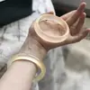 Venta al por mayor del fabricante Pulsera de Jade Natural Color Champagne Dorado Tipo Hielo Alto para Mujer Pulsera de Roca de Jadeíta Espuma de Agua Venta al por Mayor en Transmisión en Vivo