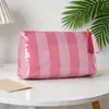 Bolsa de cosméticos de PVC transparente a rayas con borla y cremallera, bolsa de aseo impermeable para viajes, bolsa de almacenamiento portátil, comercio exterior transfronterizo