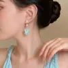 Pendientes de Borla con Forma de Pétalo de Concha Blanca de Venta Caliente Europea y Americana, Pendientes de Estrella de Mar Versátiles de Moda y Tendencia para Mujeres