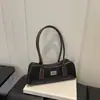 Otoño 2026 Nuevo Bolso Versátil Francés para Viajes Diarios Hombro Axila Bolso de Mano Exquisito para Mujer Bolso Baguette Bolso para Mujer al por Mayor