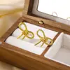 Brincos em aço inoxidável em forma de U, moda europeia e americana, torcidos, comércio exterior, transfronteiriço, revestimento a vácuo, oco, ouro 18K, atacado, brincos femininos