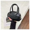 Bolso de mano de color liso estilo coreano para mujer, nueva moda de verano 2026, elegante y exquisito bolso tipo concha, moderno bolso cruzado casual