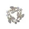Suministro directo de fábrica anillo versátil simple broche de vestido de diamantes corsage de mariposa punto broche creativo de circón para mujer