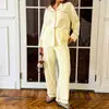 Conjunto de pijama e roupa de casa feminino de duas peças, outono/inverno 2026, europeu e americano, transfronteiriço, macio, solto, com blocos de cor, lapela, manga longa e calça longa.