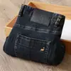 Nuevos jeans de alta gama para hombre 2023 otoño e invierno lavado blanco europeo cintura media-alta elásticos holgados rectos