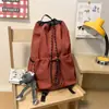 Bolso cubo con cordón de tela de nailon estilo coreano nuevo para mujer, mochila de viaje versátil, mochila escolar de gran capacidad para estudiantes, moda