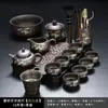 Juego de té de arcilla púrpura con diseño de bambú dorado, que incluye una tetera y tazas de servicio para uso doméstico, con un asa para prevenir quemaduras y asegurar la distribución uniforme del té