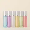 Botella de vidrio con roller de 10 ml de color para venta al por mayor, botella go ball, botella de vidrio, botella vacía, botella para aceite esencial, botella de perfume de vidrio, botella