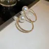 Pendientes de perlas de estilo coreano con broche de plata, pendientes de alta gama de nicho de moda, pendientes con diseño de personalidad, venta al por mayor para mujeres