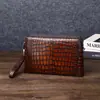 Bolsa de Mano de Cocodrilo al por Mayor de Fábrica con Patrón de Doble Cremallera y Cerradura de Contraseña Color Pulido para Hombre Casual de Gran Capacidad de Moda