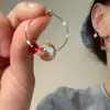 Pendientes de Aro de Bola Coloridos Estilo Vintage Hong Kong 2025 Nuevos Populares para Mujer Moda Nicho Versátiles Pendientes Clip-On de Bobina de Mosquito