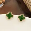 Nuevos Pendientes de Cristal Verde de Trébol de Cuatro Hojas Flores Pequeñas Versátiles Lujo Ligero Pendientes de Botón de Gama Alta Pendientes Simples para Mujer