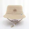 Chapéu de Pescador Infantil Redondo com Logo em Letra, Novo Chapéu de Sol para Férias Outdoor Transfronteiriço, Chapéu Balde para Bebê Primavera e Verão