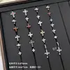 Nuevos y modernos aretes de cruz con diamantes completos Jiuhan para mujer, ear cuffs de acero de titanio de nicho, populares tachuelas de hueso de la oreja de alta gama