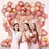 Set de arco de globos bestseller transfronterizo en color oro rosa y rosa claro con cortina de flecos de lluvia y globos de foil en forma de corazón para la decoración del primer cumpleaños de una niña