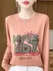 Nueva camiseta de punto casual de otoño para mujer con estampado de letras de dibujos animados, manga larga, cuello redondo, corte holgado, top fino y adelgazante
