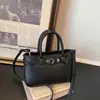 Bolso de mano con patrón de lichi para mujer, nuevo modelo de moda de verano 2026, bolso de hombro y bandolera de alta gama, nicho, lujo ligero, para el día a día