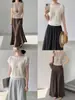 Top de punto Goming estilo coreano con hombros descubiertos y mangas acampanadas para mujer, nueva camiseta de punto de Guangzhou Thirteen Lines AN428