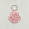 Novo pingente memorial criativo para guardar pelos de pet, porta-cartão de acesso à porta anti-perda, pingente de chaveiro de pata de cachorro