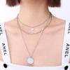 Europa y los Estados Unidos en viento frío collar de clavícula apilado de tres capas acero de titanio PVD recubrimiento al vacío oro de 18 quilates fabricantes una generación de cabello