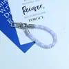 Huayang Macaron Cordón de Teléfono Colorido Correa de Muñeca Anti-Pérdida de Gama Alta Llavero Colgante para Bolsa Venta al por Mayor