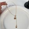 Collar sencillo con borlas de sol marrón Maillard para mujer, cadena de clavícula de lujo, ligera y de alta gama, accesorios transfronterizos europeos y americanos.