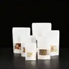 Bolsa de papel kraft autosoportante con ventana para frutos secos, té, snacks de ocio, bolsa de embalaje, bolsa engrosada para cereales integrales, autosellante, venta al por mayor