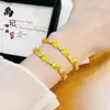 Pulsera de Trébol de Cuatro Hojas y Calabaza con Amuletos de la Suerte Chapados en Oro, Pulsera de Esmalte y Cristal de Ojo de Gato de Moda Versátil para Mujer