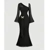 Vestido midi de gasa fina ligeramente transparente de color liso estilo chica picante con mangas acampanadas para mujer primavera y otoño transfronterizo decoración tridimensional ceñido a la cintura vestido largo de cola de pez
