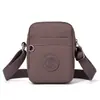 2026 Bolso Cruzado Pequeño Nuevo de Comercio Exterior Transfronterizo para Mujer, Estilo Vertical con Múltiples Bolsillos, Tela de Nylon, Bolso para Teléfono de Hombro Único Resistente al Agua
