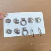 Pendientes plisados de flor redonda de metal de aguja plateada, de moda, sencillos, de lujo ligero, pendientes de alta gama, pendientes versátiles y exquisitos para mujer