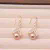 Pendientes de Lujo Accesible de Gama Alta Color Oro Champagne Perla Diseño de Nicho Retro Únicos Elegantes Nuevos Pendientes de Moda