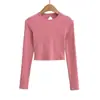 Chica atractiva cuello redondo elástica ajuste ceñido Sexy espalda descubierta con tiras cruzadas manga larga Camiseta corta ajustada para mujer