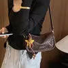 Bolsa de pão macia com textura de trama de alta qualidade para mulheres, novo estilo 2026, bolsa versátil e elegante de ombro único, transversal, para o trabalho, de mão, bolsa almofada