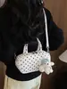Bolso de lunares de nicho transfronterizo para mujer, nuevo y exquisito minibolso cruzado versátil 2026, bolso cilíndrico de un solo hombro a la moda