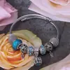 Pulsera simple de acero inoxidable europea y americana nota hueca aleación con cuentas DIY colgante de corona Pulsera de dama