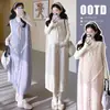 Conjunto de top de tricô para maternidade estilo coreano com gola alta e babados + colete e saia com laço macio - Outono/Inverno 2026