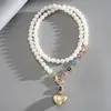 Collar de perlas en capas con cuentas transfronterizo europeo y americano, cadena para la clavícula estilo fiesta vintage, lujo ligero, accesorio versátil de alta gama para mujer